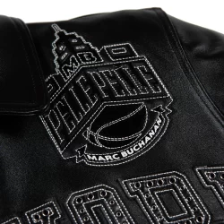 Pelle Pelle New York Knicks black leather jacket by Marc Buchanan premium NBA leather jacket embroidered all black Knicks Pelle Pelle jacket available at Brick City Leather